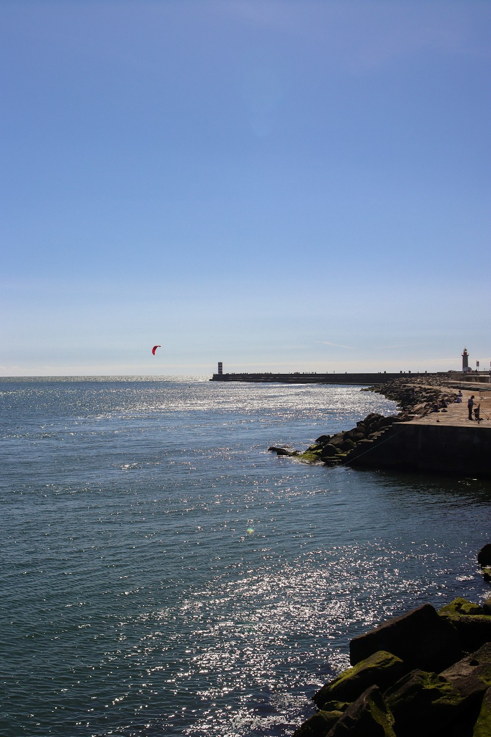 a person para sailing in the ocean on a sunny day