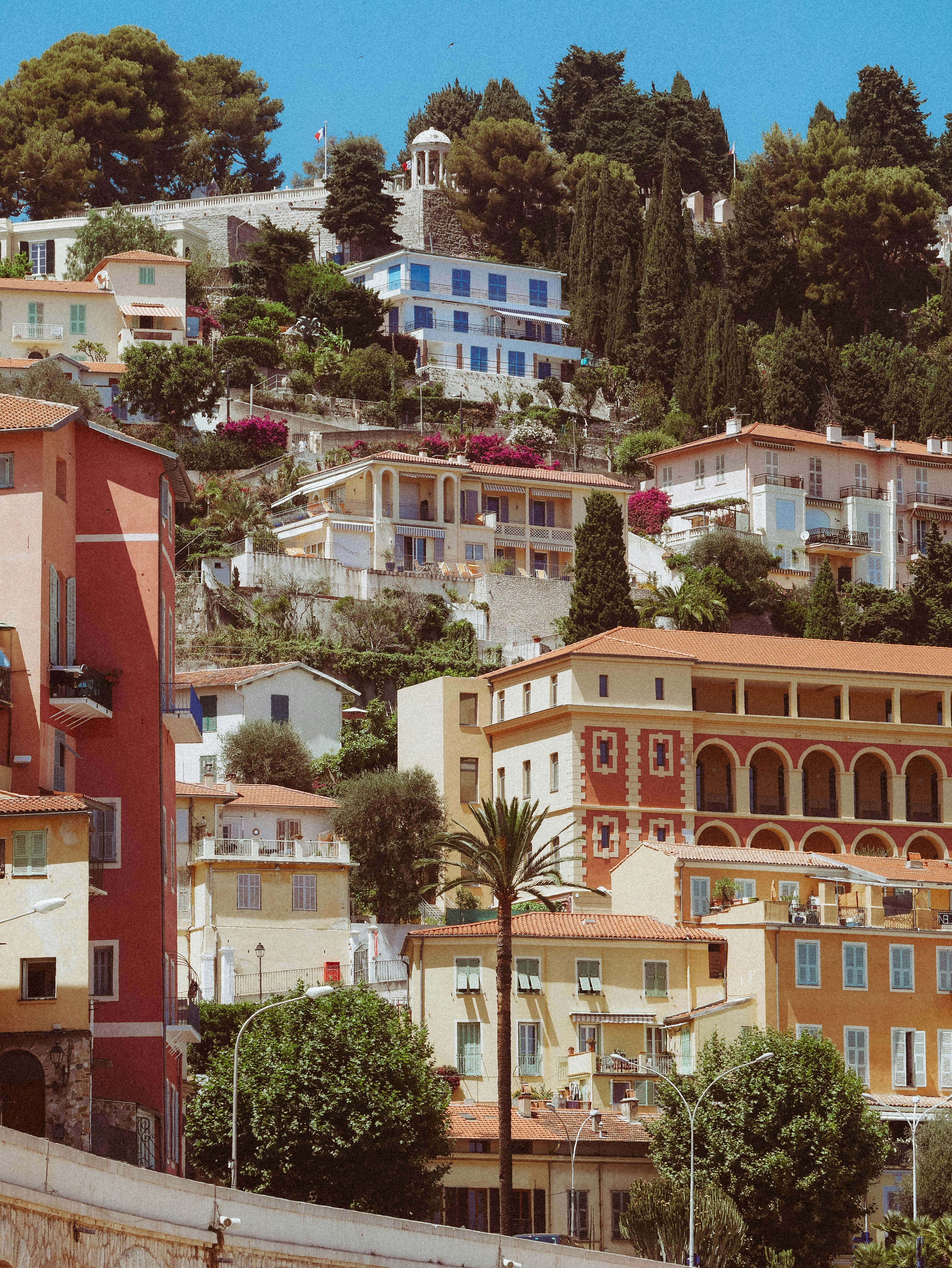 a city with lots of buildings on a hill