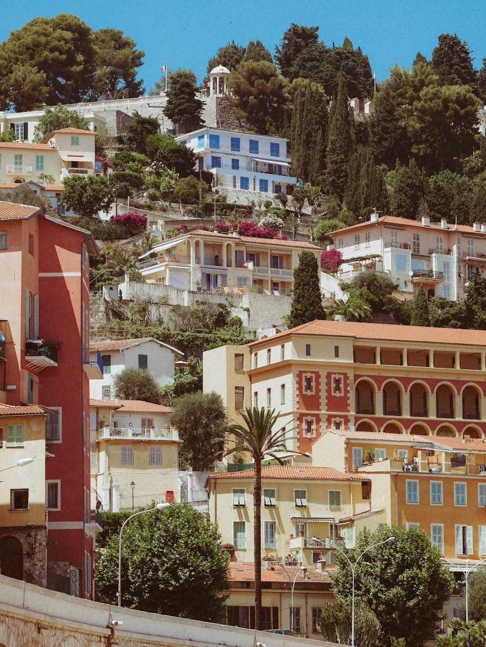 a city with lots of buildings on a hill