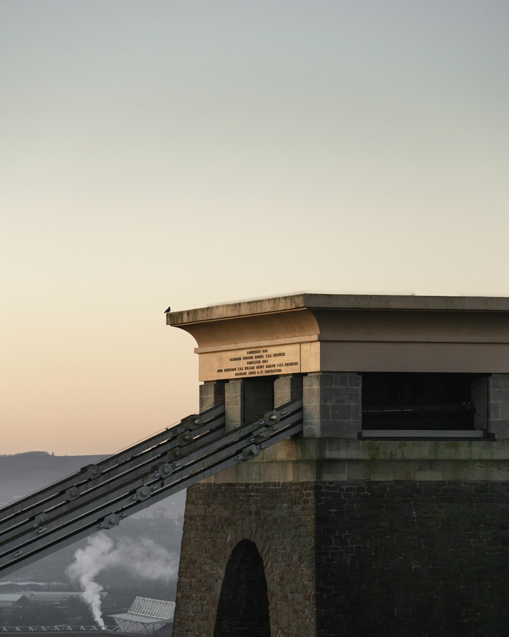 a view of the top of a building with a slide going down it