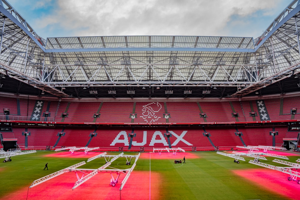 a stadium filled with lots of red seats