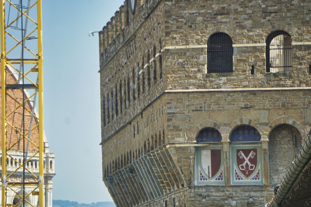 a tall brick building with a clock on it's face