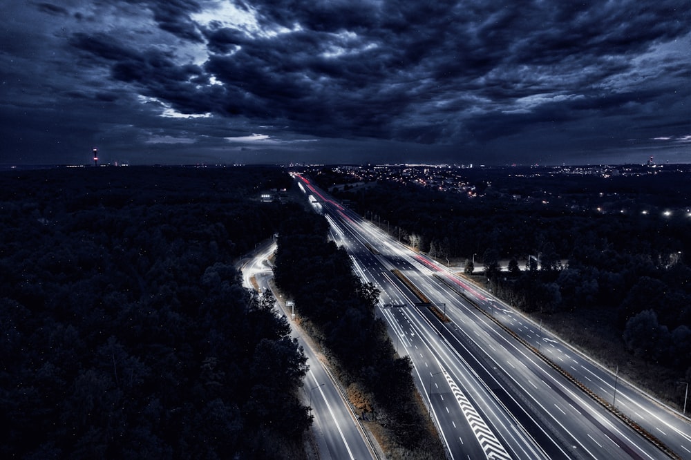 an aerial view of a highway at night