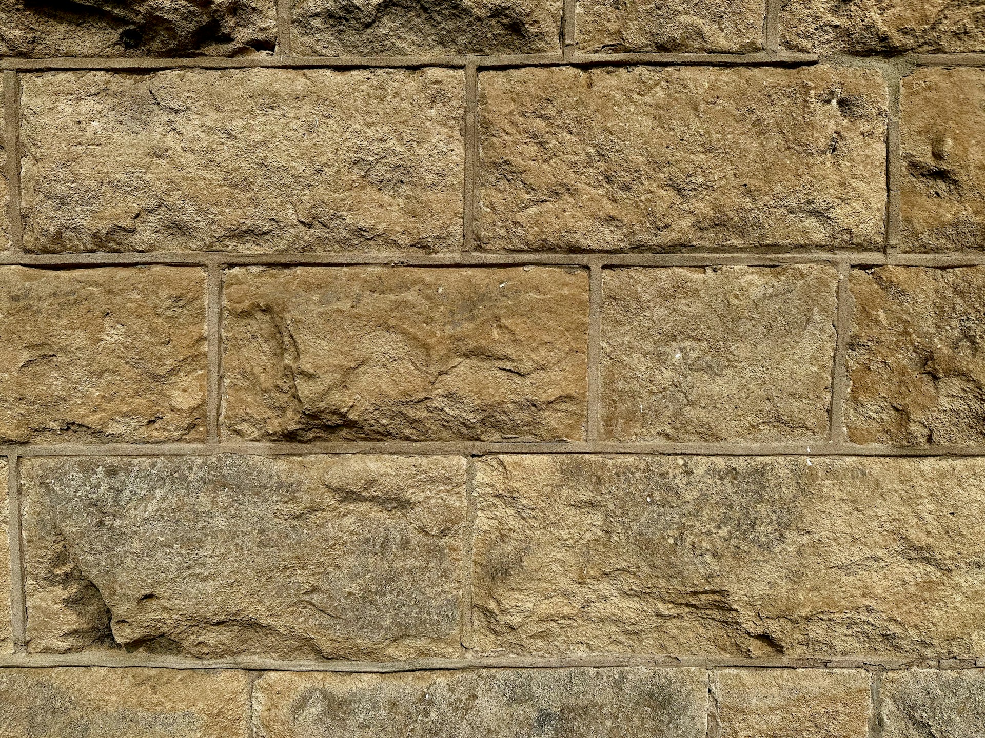 a close up of a wall made of stone blocks