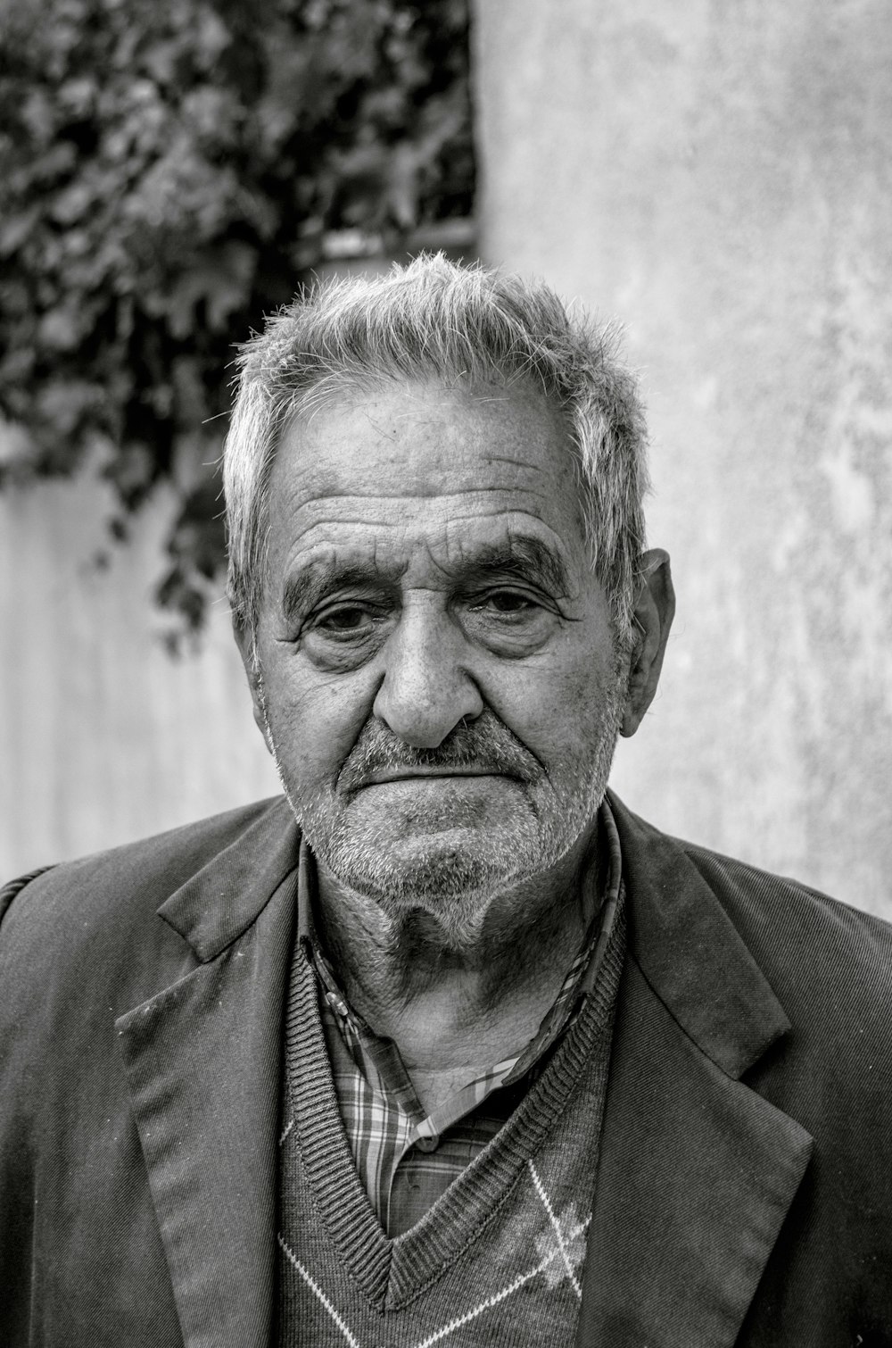 a black and white photo of a man in a suit