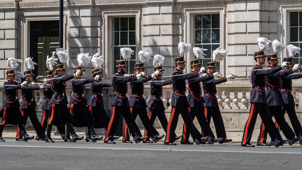 a group of men in uniform marching down a street