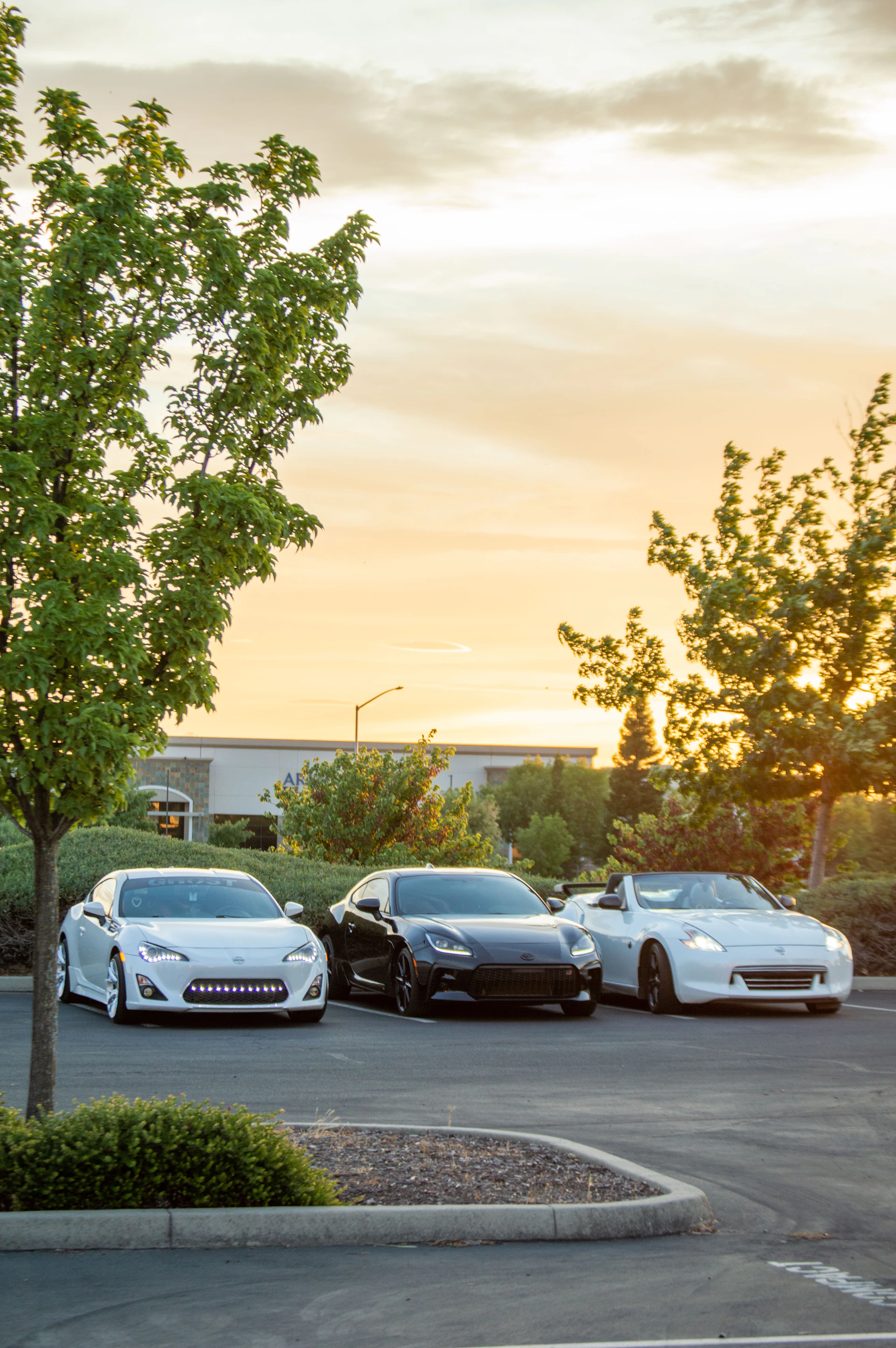 a group of cars parked in a parking lot