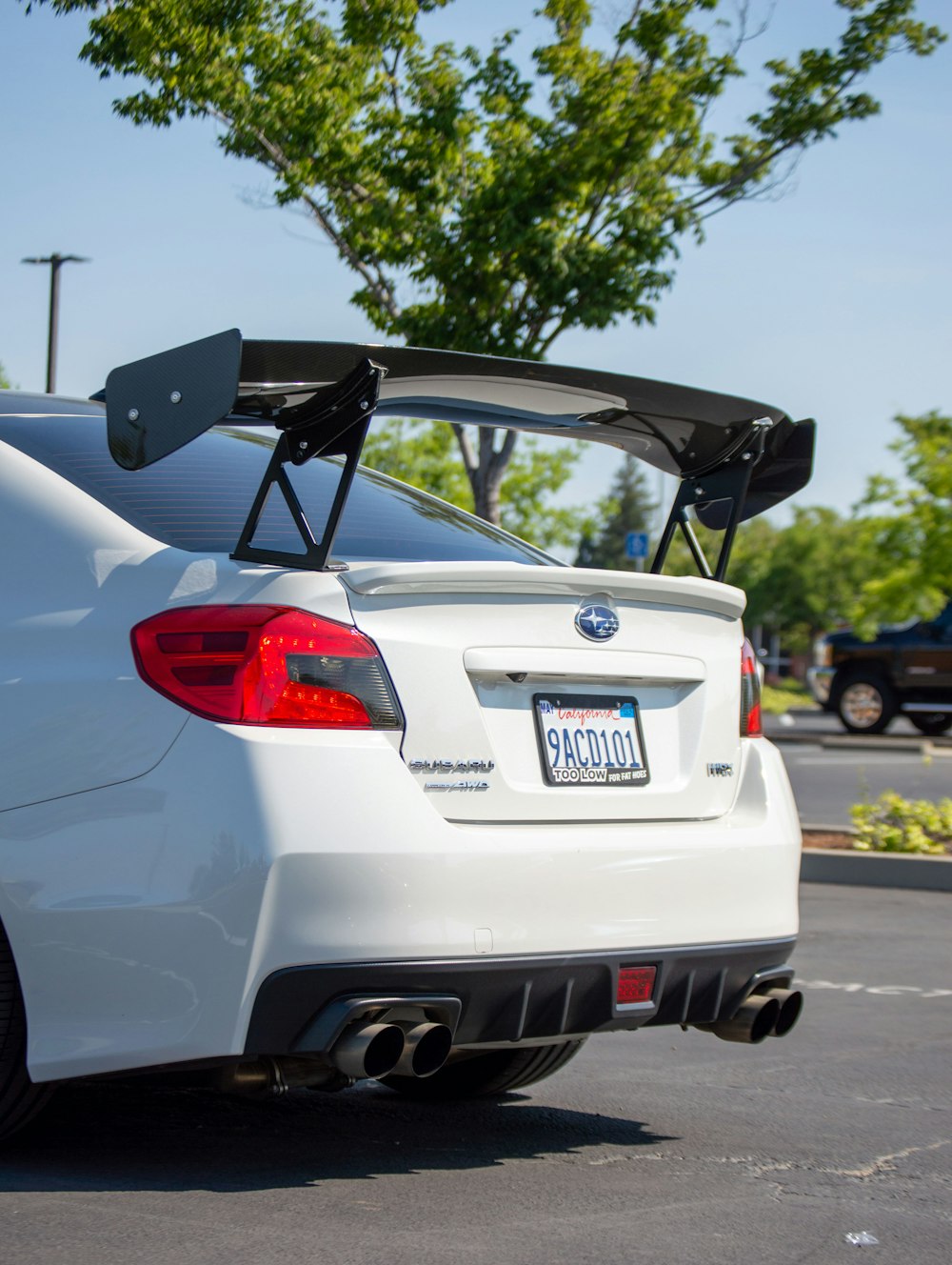 a white car parked in a parking lot