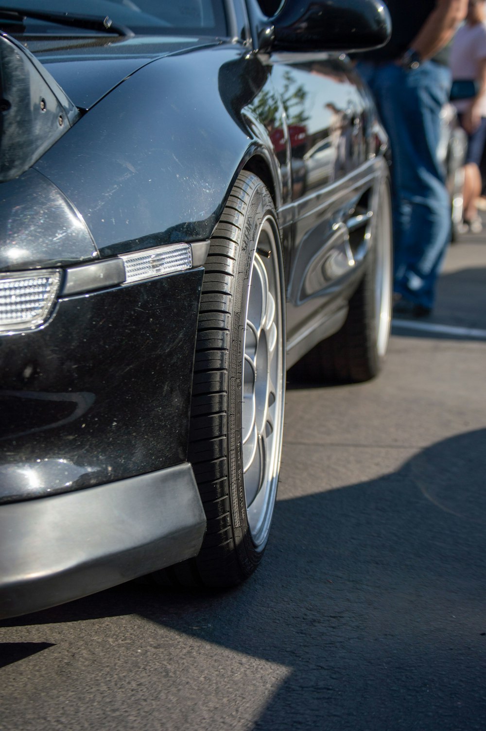 a close up of a car parked on the side of the road