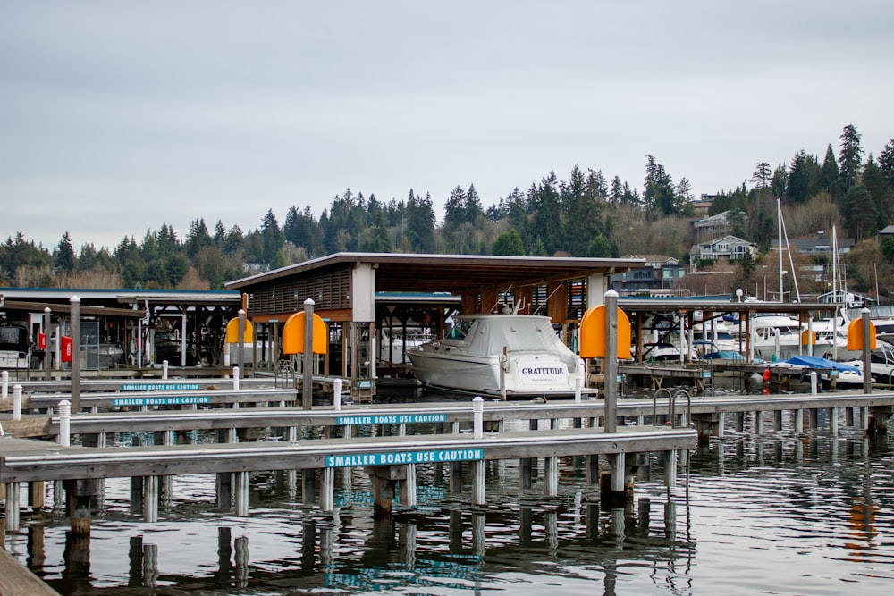 a boat is docked at a dock in the water