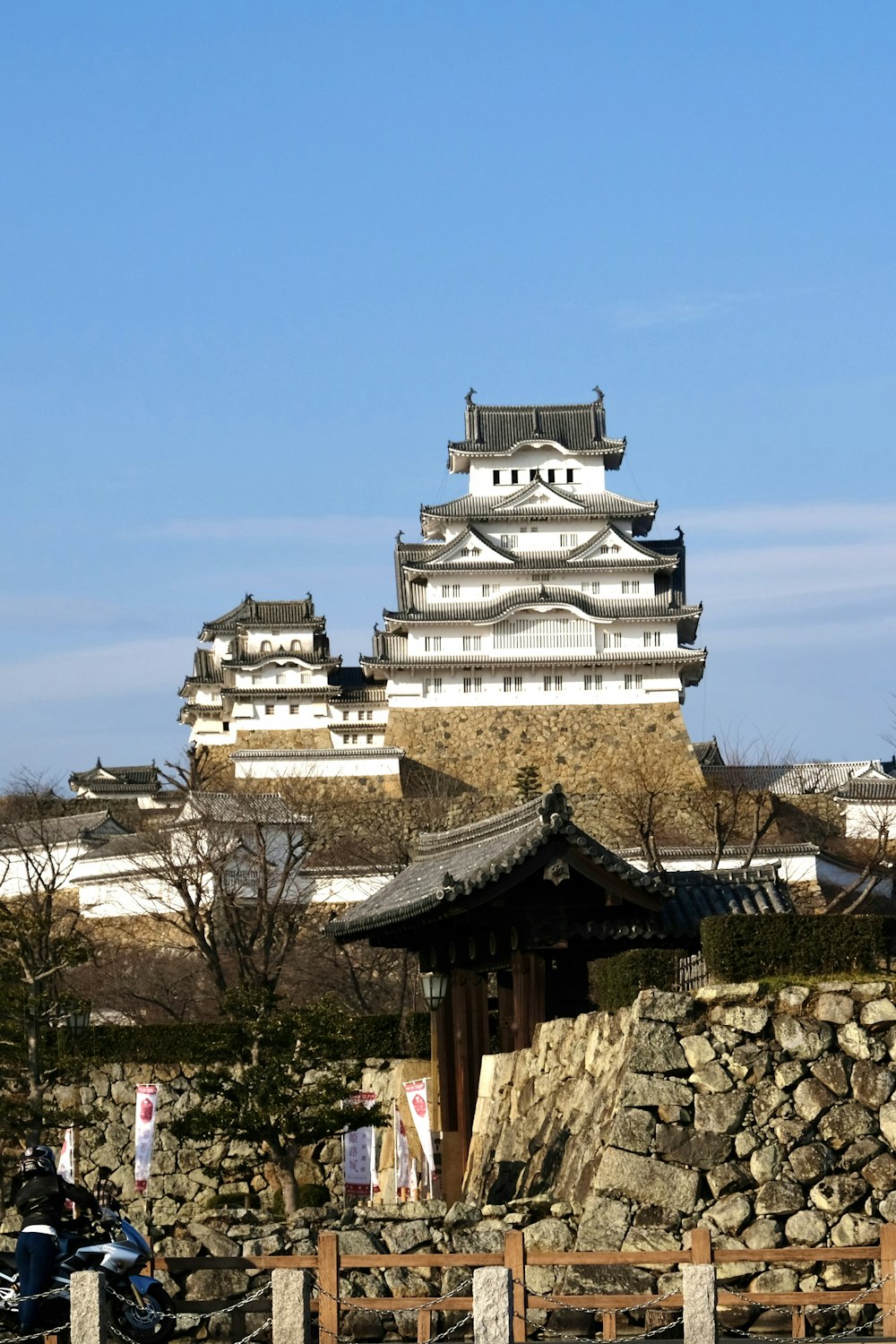 a large white building sitting on top of a hill