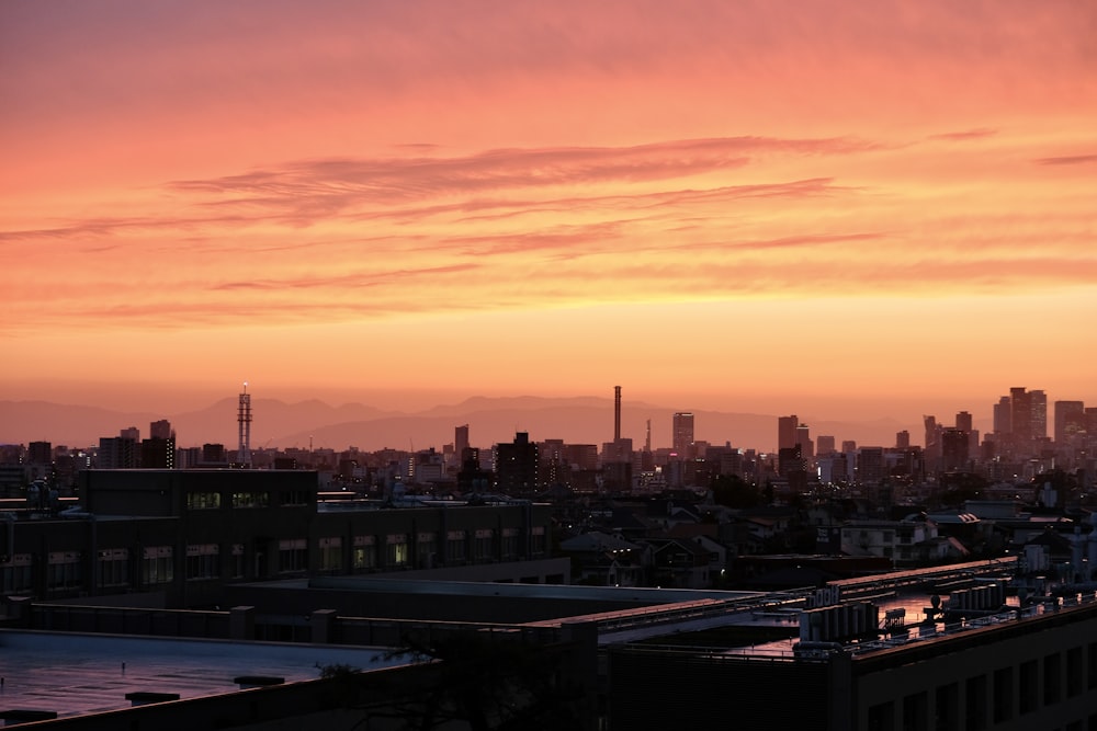 a view of a city skyline at sunset