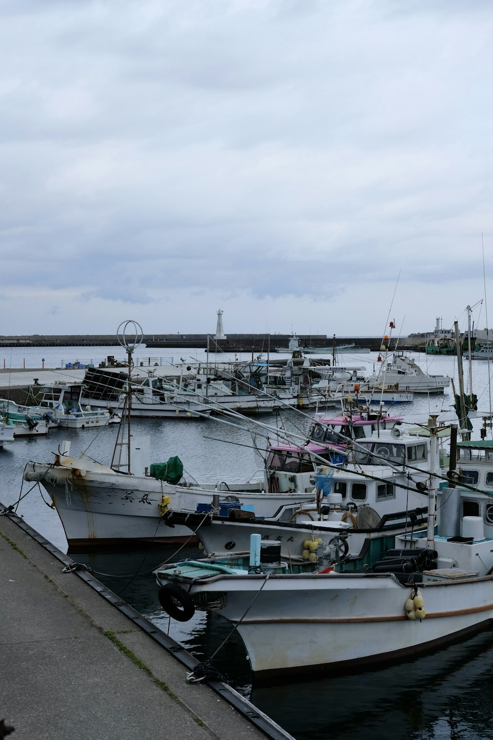 a group of boats that are sitting in the water