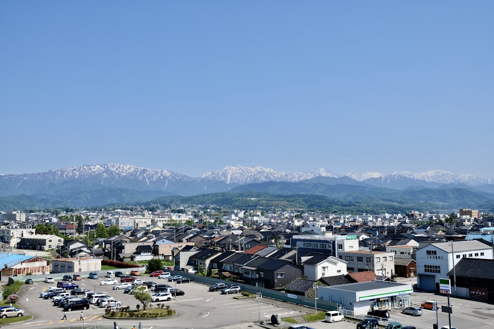 a view of a city with mountains in the background