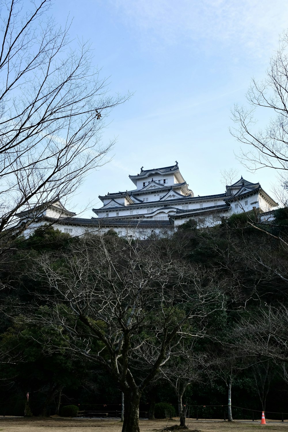 a large white building sitting on top of a hill