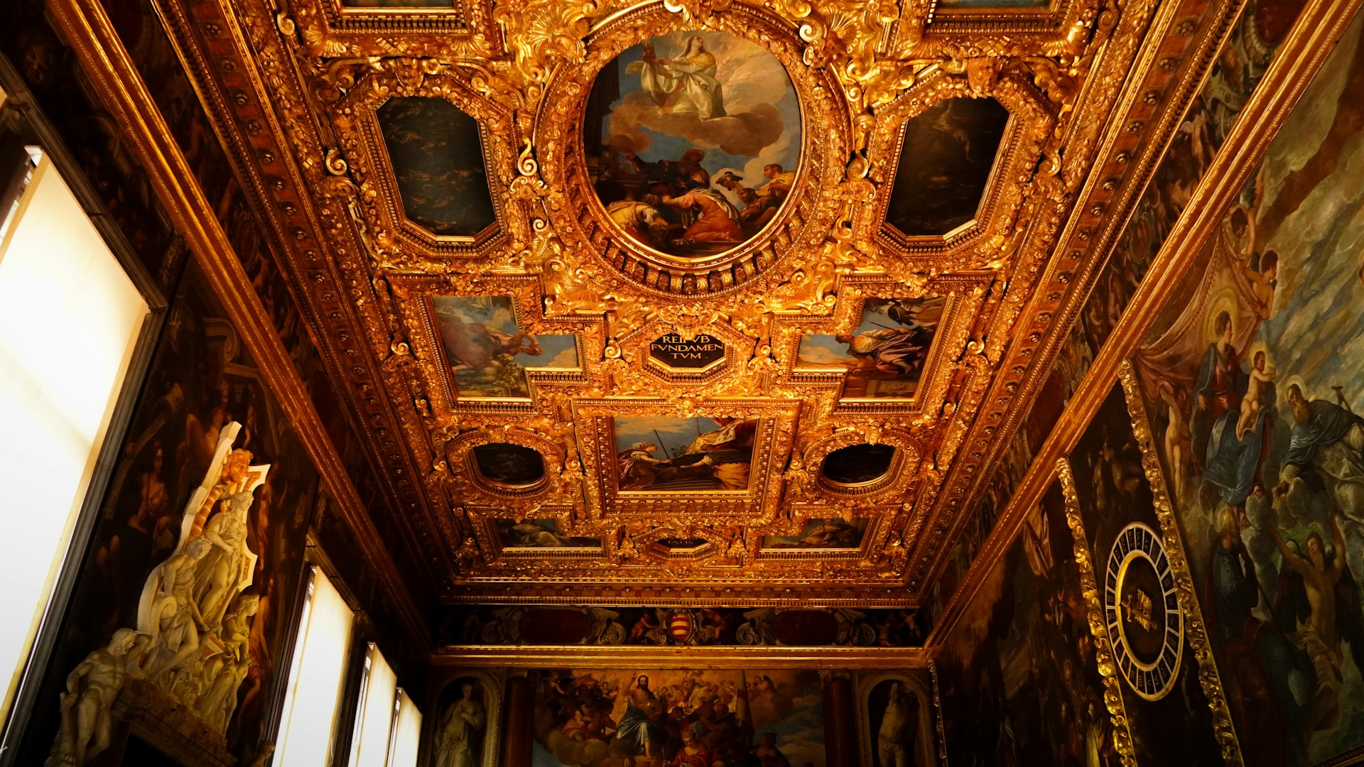 the ceiling of a room with paintings on it