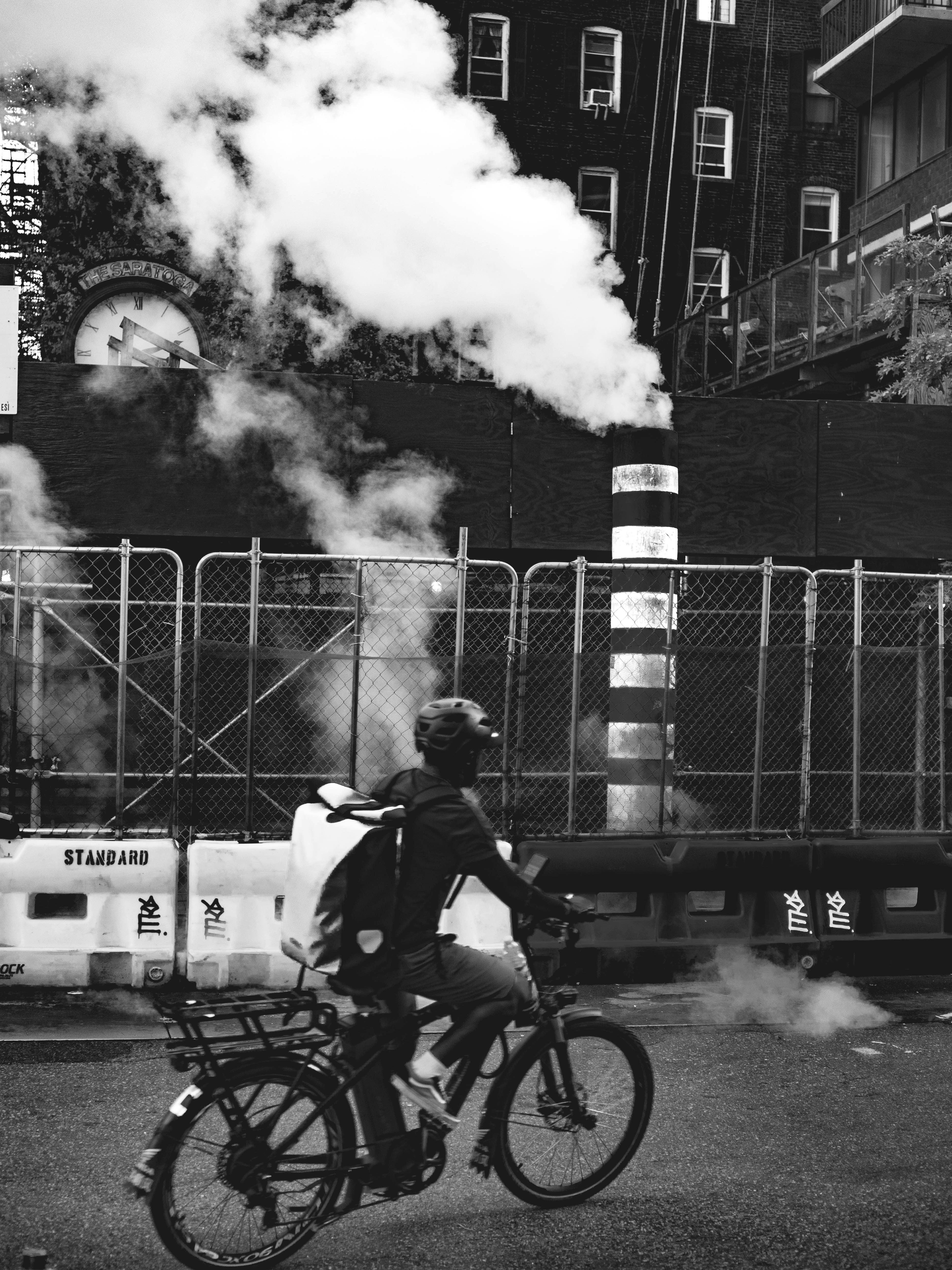 a person riding a bike on a city street