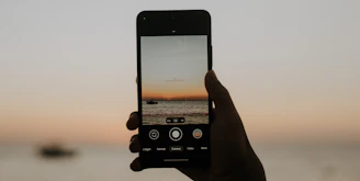 Modern booking interface displayed on a smartphone with a calm ocean background.