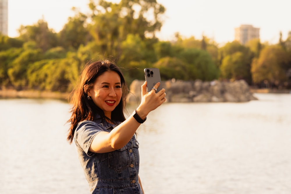 a woman taking a picture with her cell phone