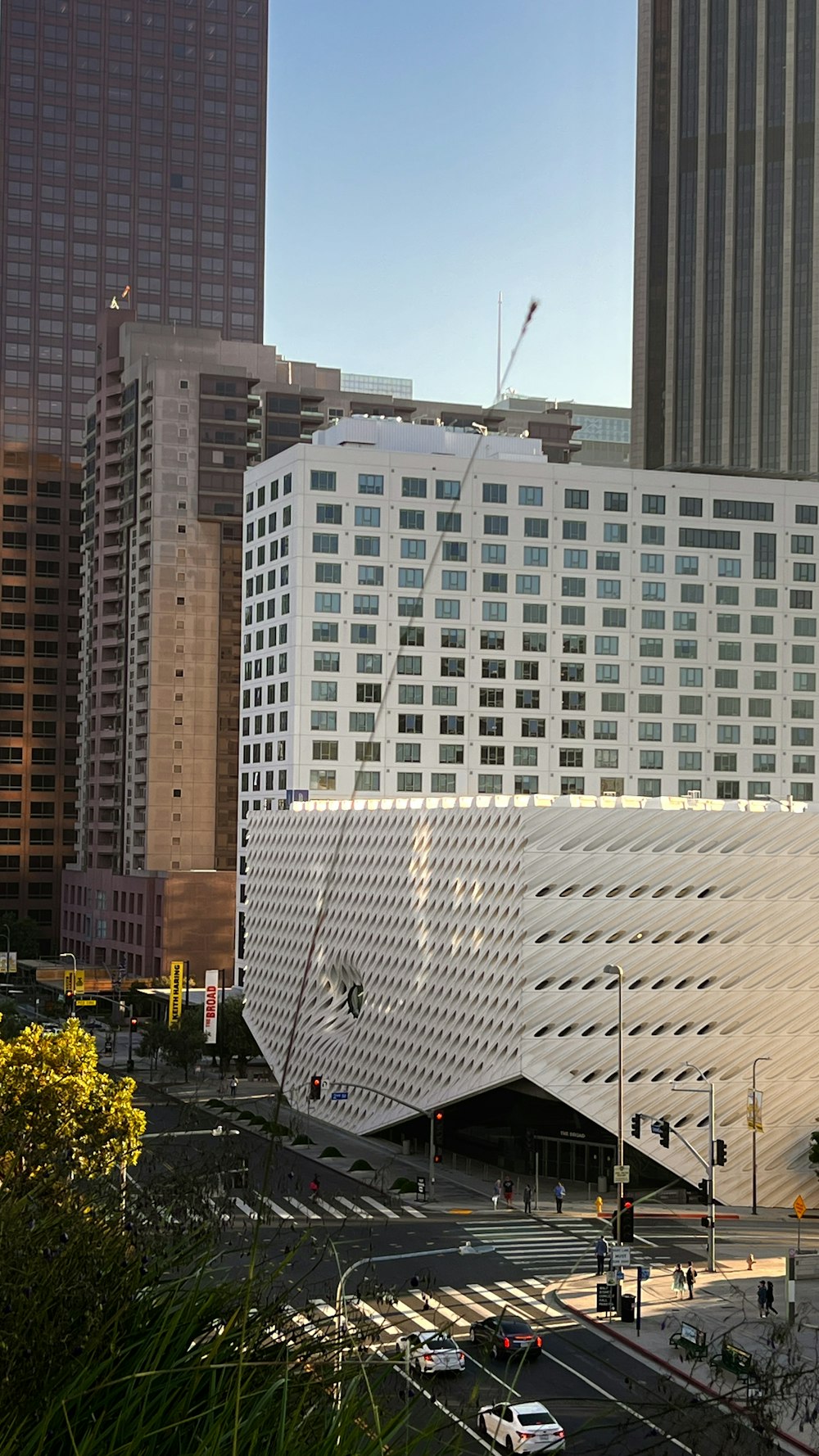 a large white building in the middle of a city