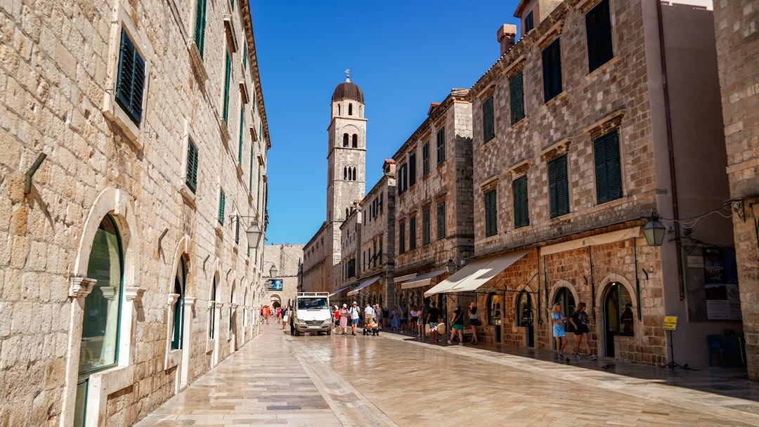 a city street with a clock tower in the background,