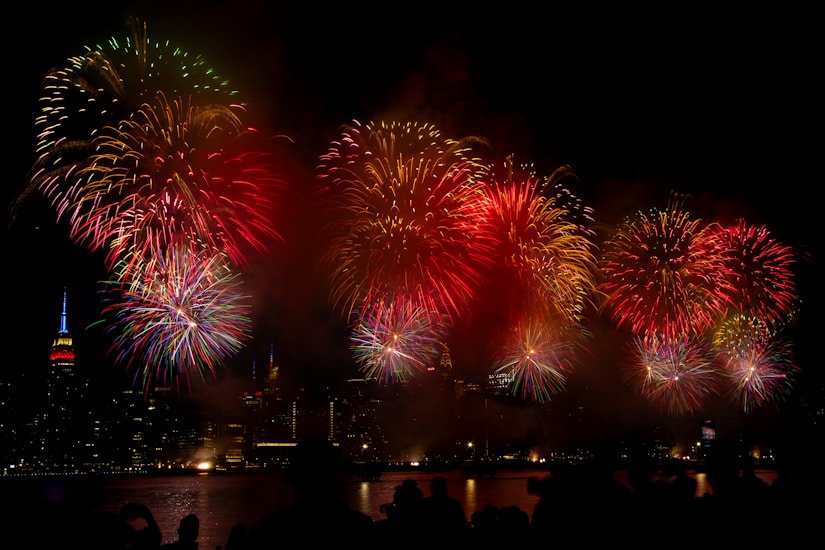 Colorful fireworks bursting over Salvador's skyline at night