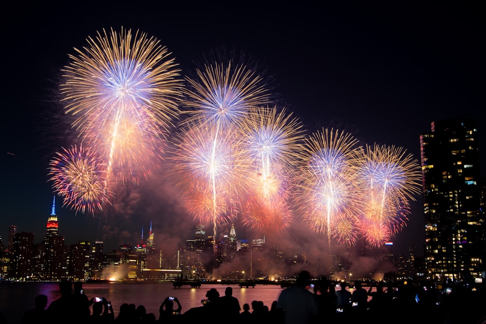 a large group of people watching a fireworks display