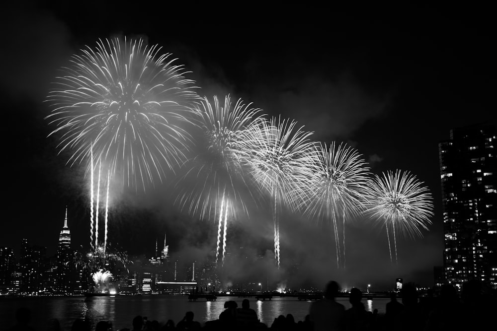 a black and white photo of a fireworks display