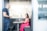 A customer happily discussing insurance options with an advisor in a modern office