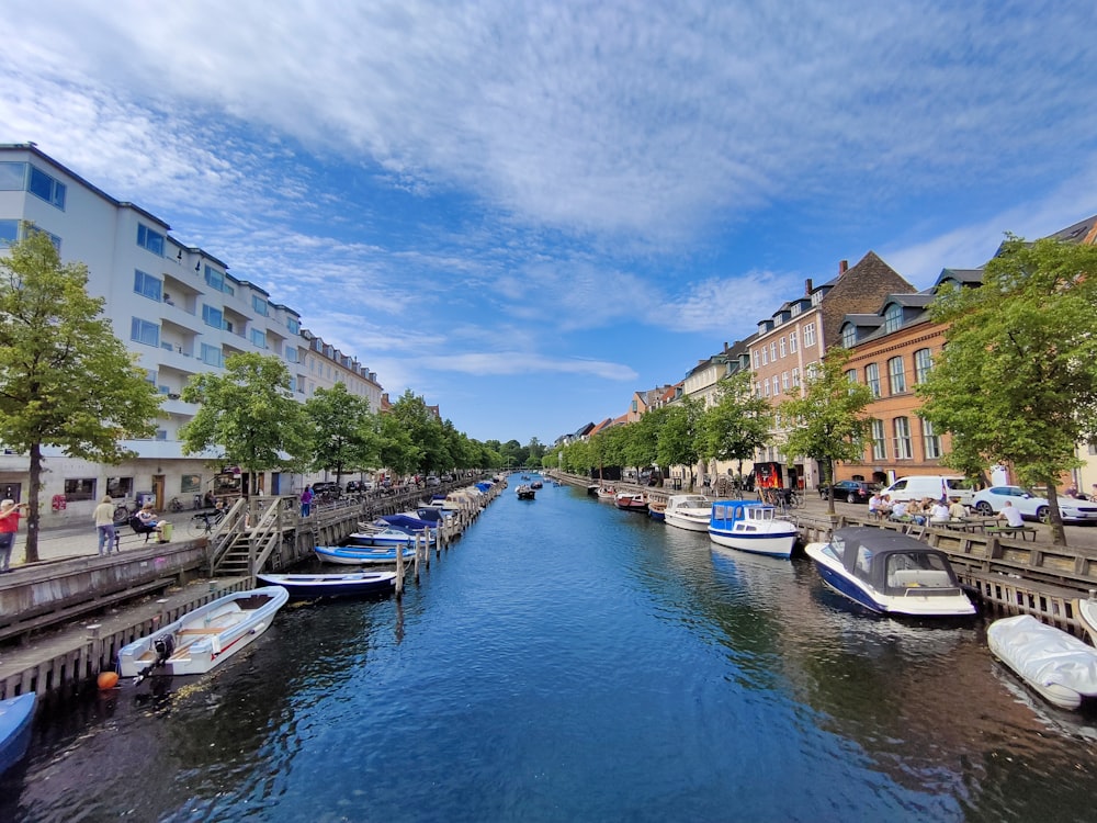 a river running through a city next to tall buildings