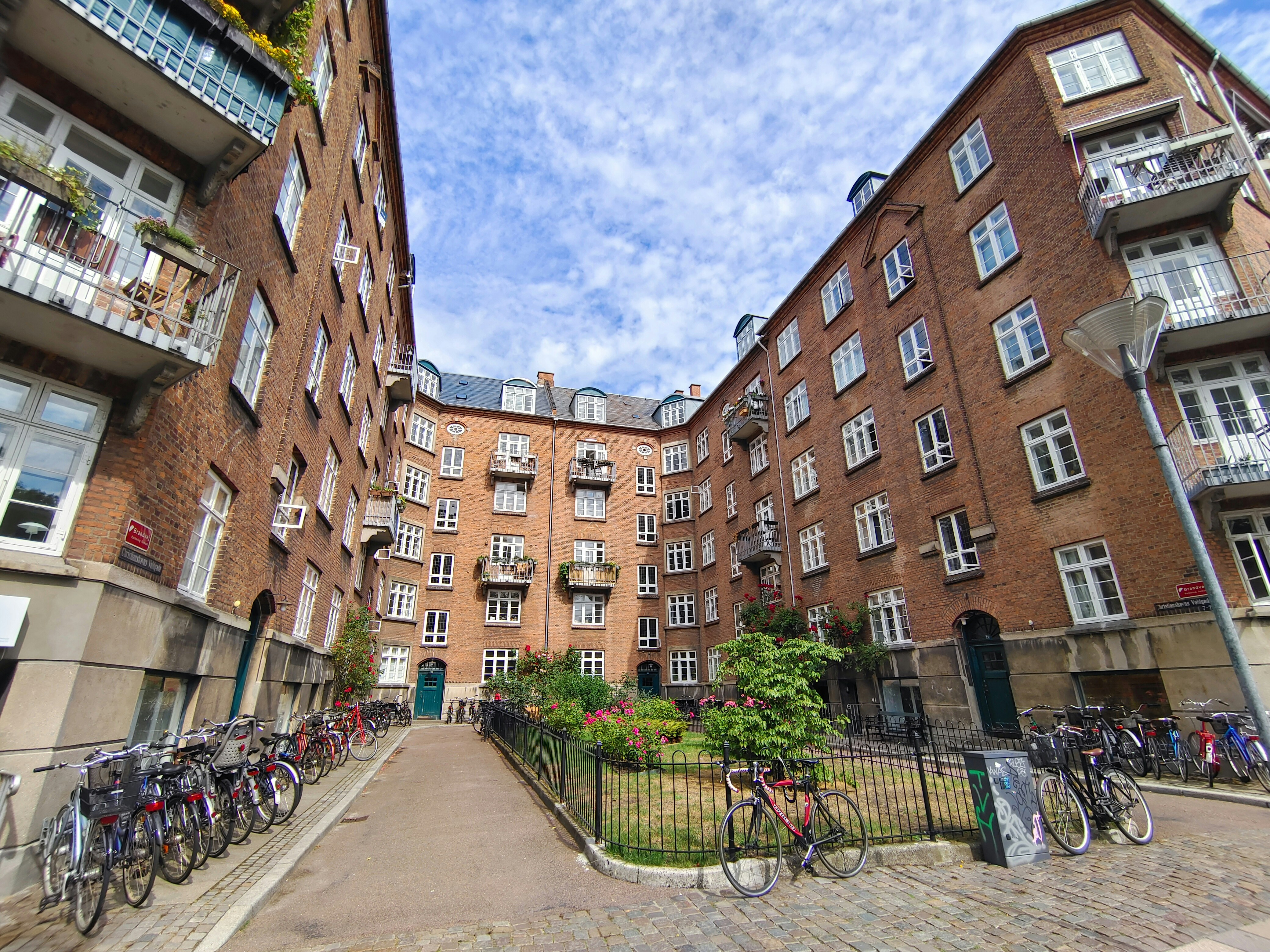a group of bikes parked next to each other on a street