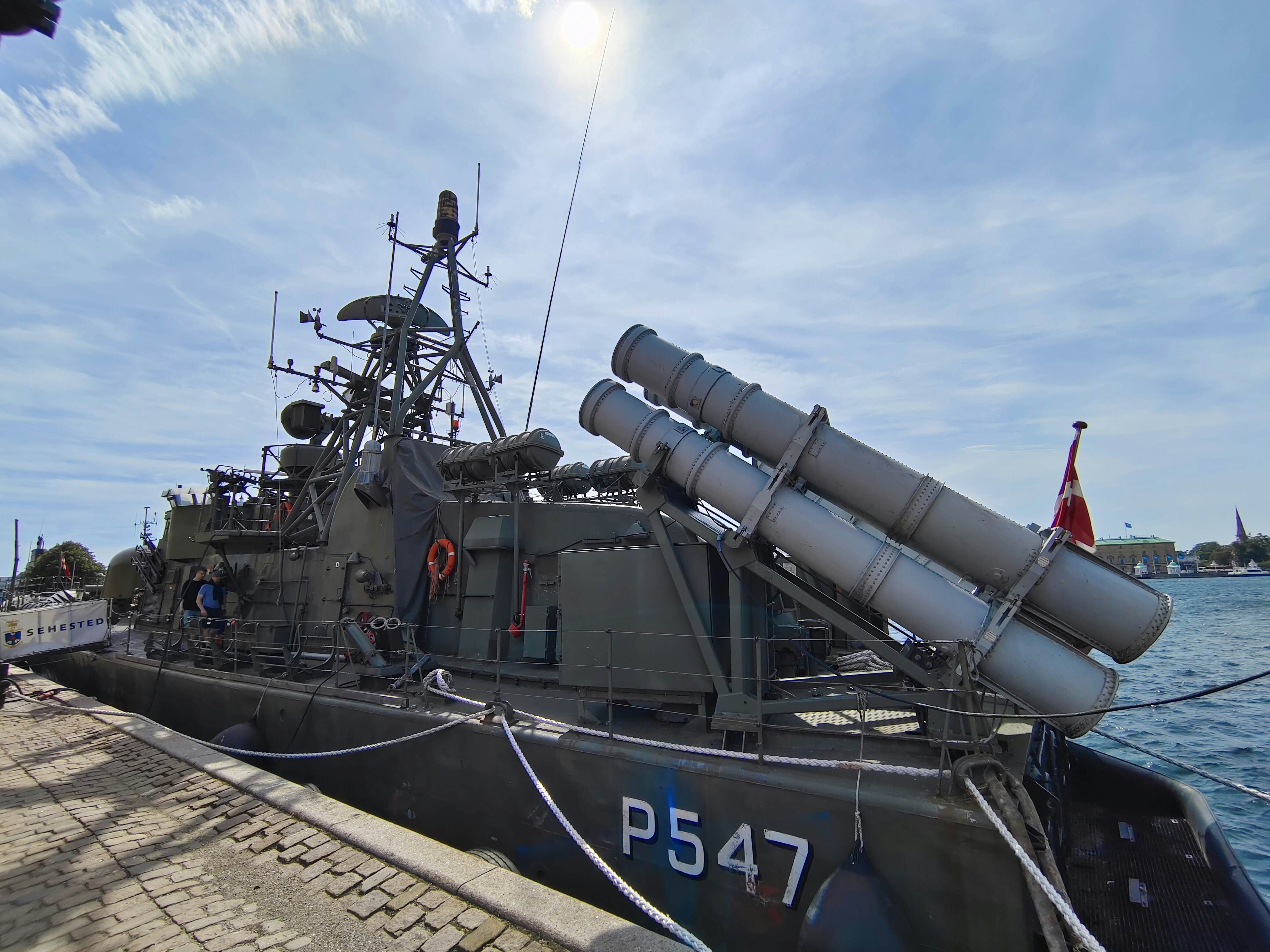 a boat with a large metal object on top of it