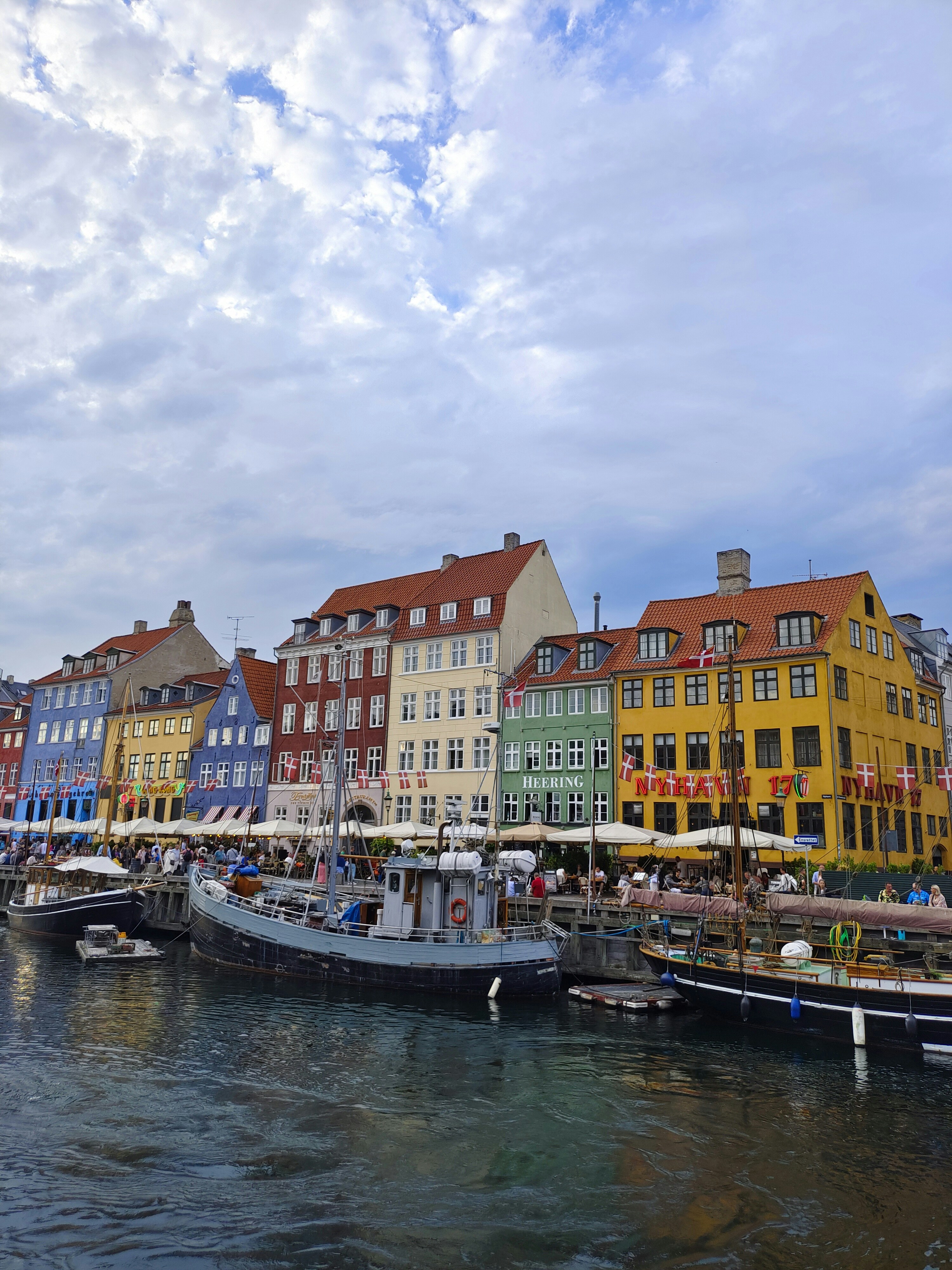 a row of buildings next to a body of water