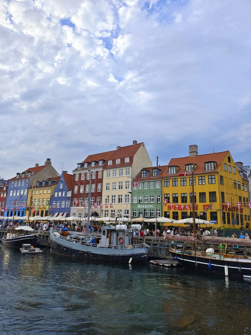 a row of buildings next to a body of water