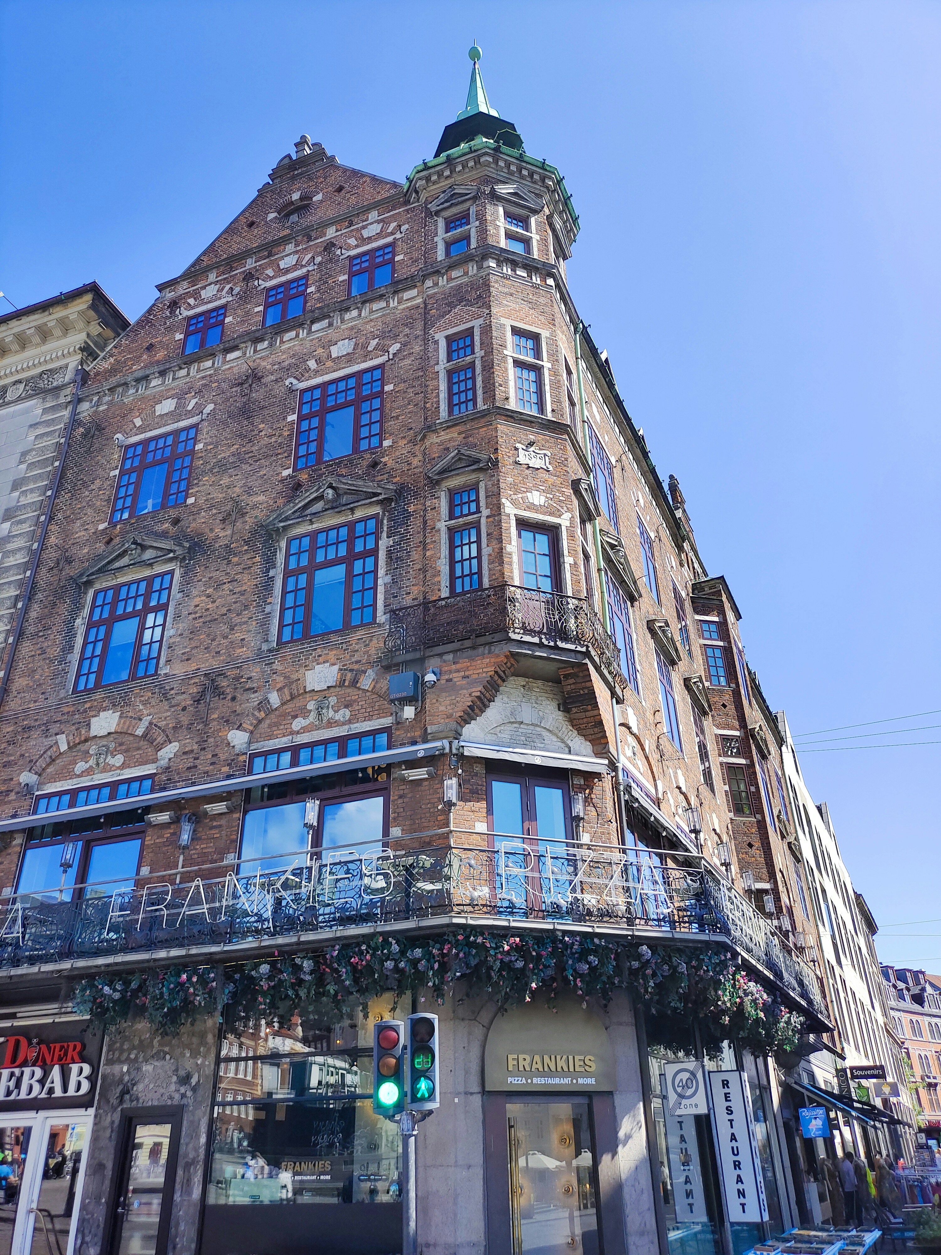 a tall brick building with lots of windows