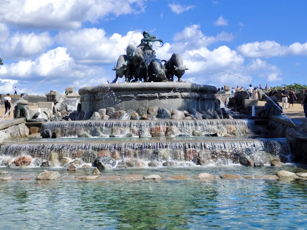 a fountain with a statue on top of it