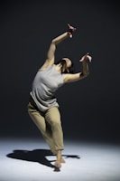 Close-up of expressive hands in motion, highlighting the grace of contemporary dance.
