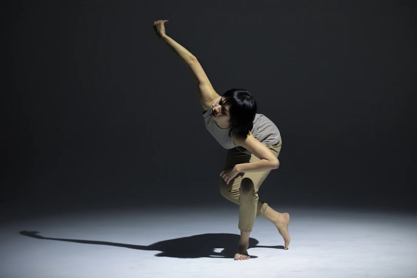 a woman standing on one leg in a pose