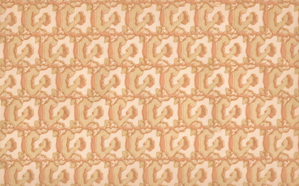 a beige and orange wallpaper with a design on it