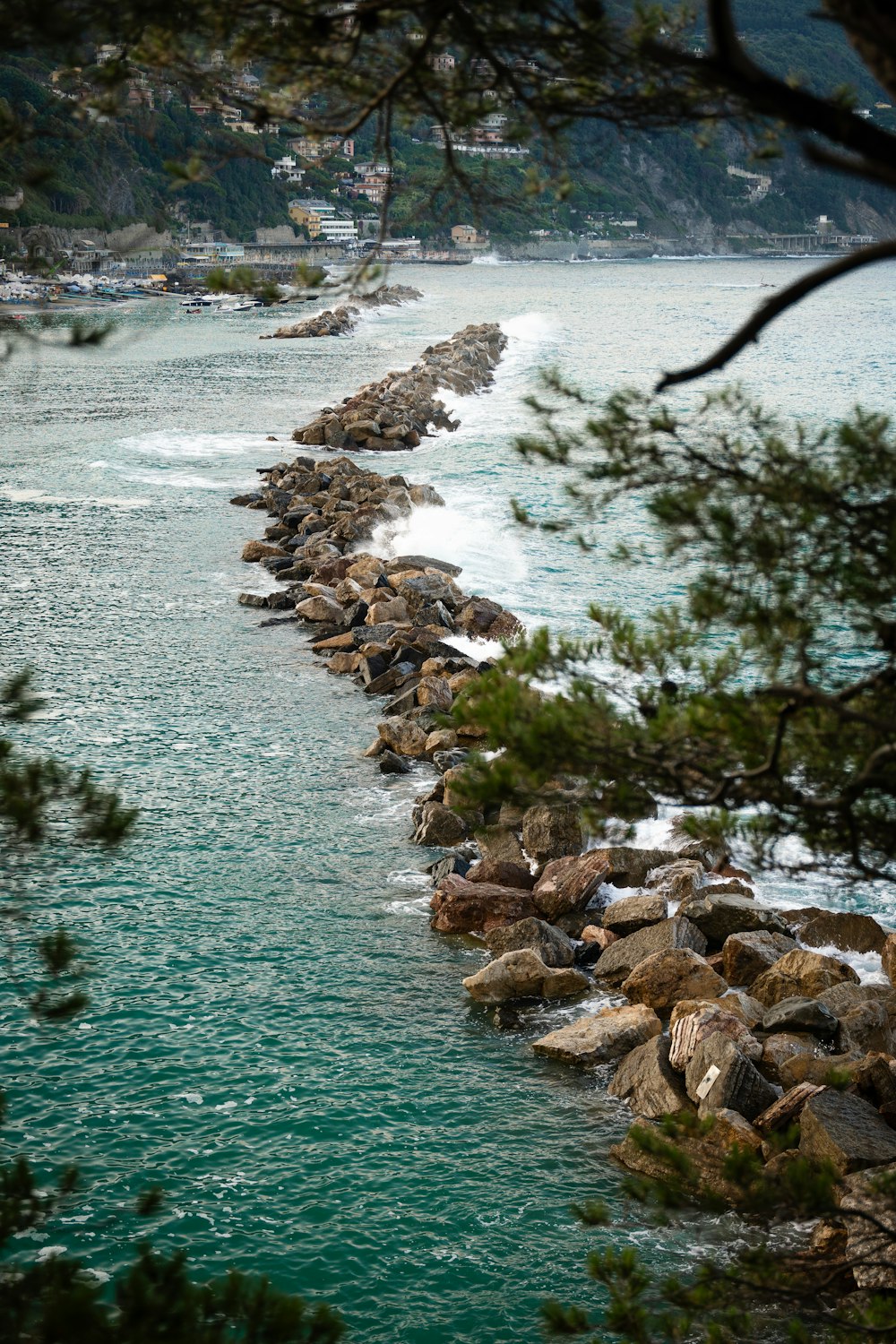 a body of water surrounded by rocks and trees