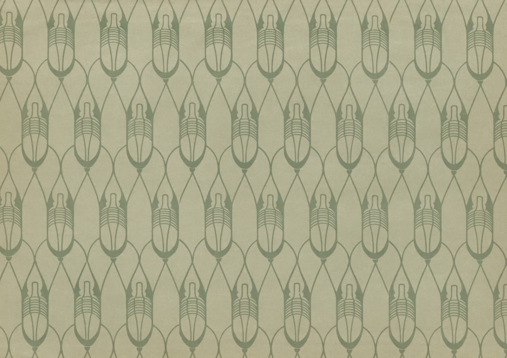 a beige and green wallpaper with a design on it