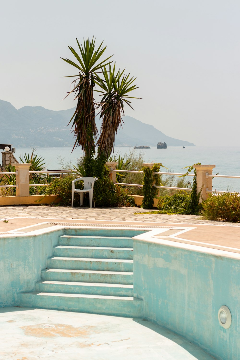 a pool with steps leading to the water