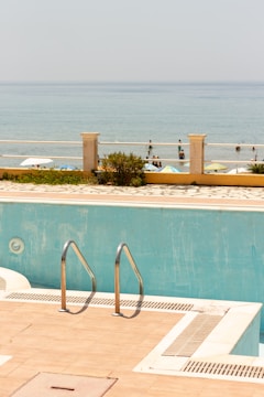 Before and after images of a pool with new dry and wet beach areas