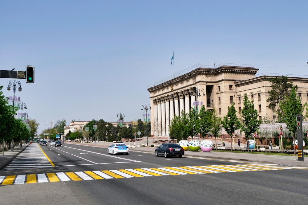 a city street with a traffic light and a building