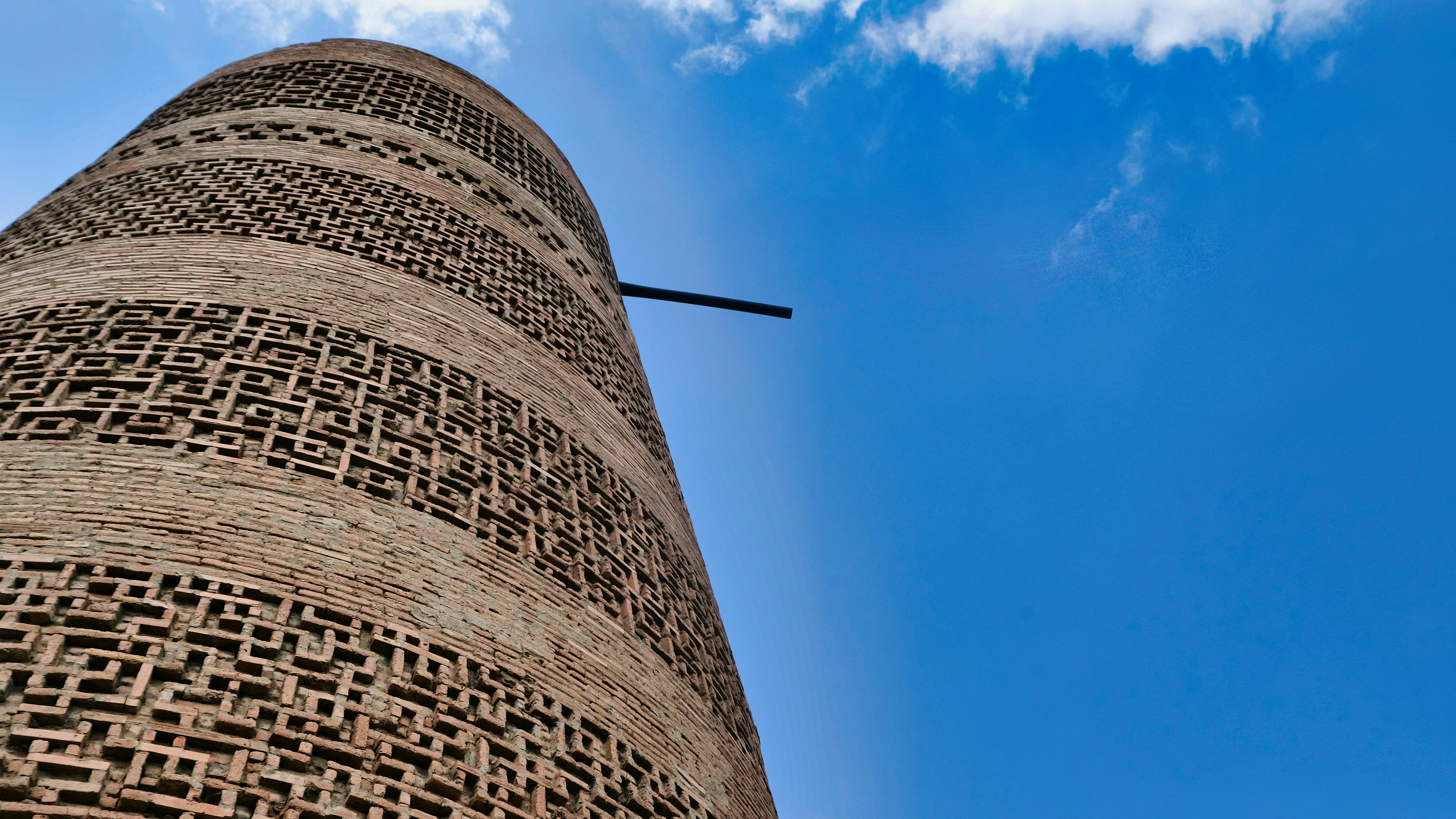 a tall brick structure with a sky background