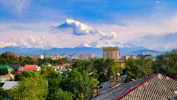 A view of a city with mountains in the background — Bishkek, Kyrgyzstan
