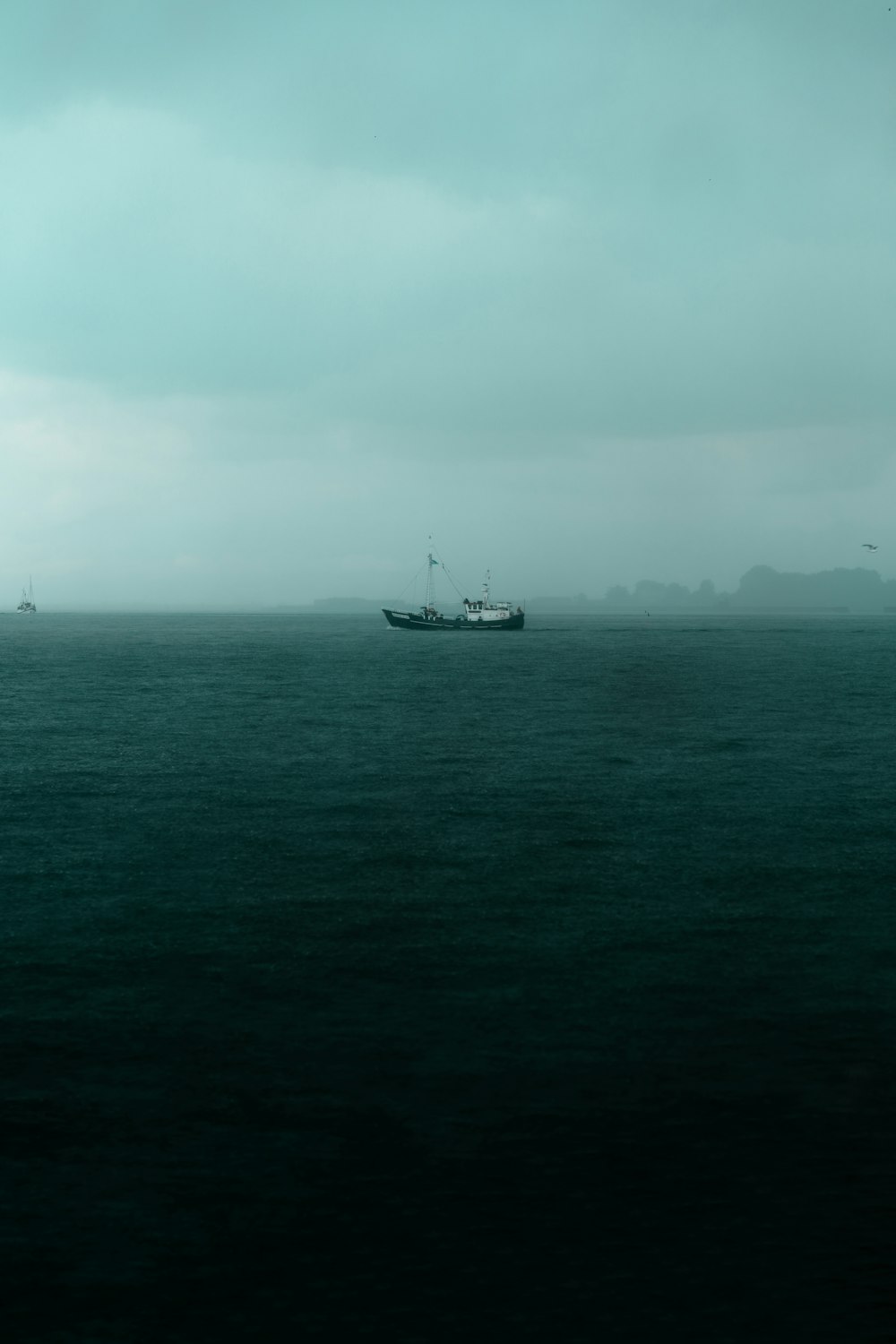 a boat in the middle of a large body of water