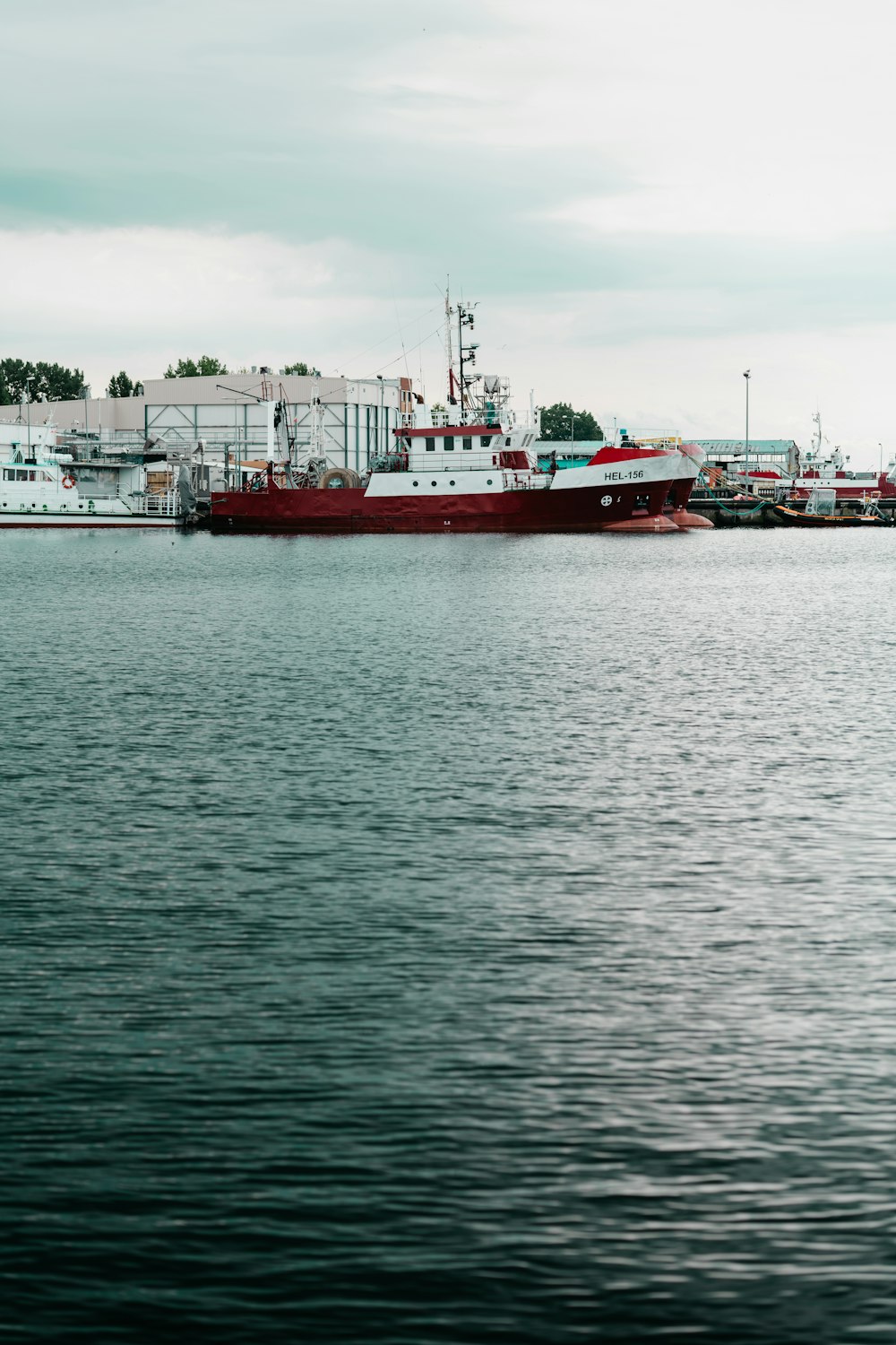 a large red boat in a body of water