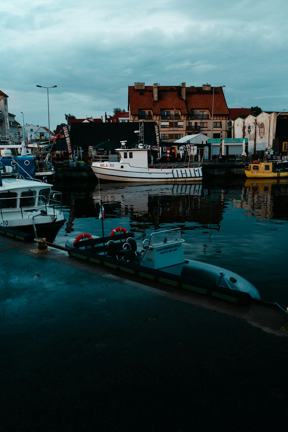 a harbor filled with lots of boats on top of water