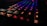 A close-up of a sleek mechanical keyboard with colorful backlighting.